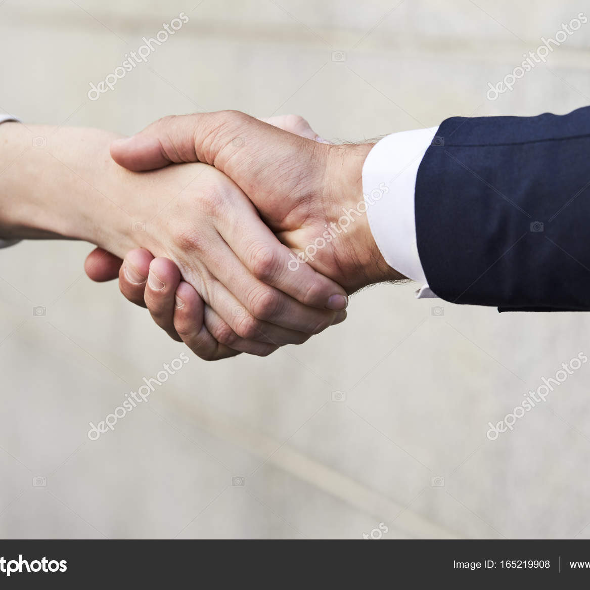 Business colleagues shaking hands in close up